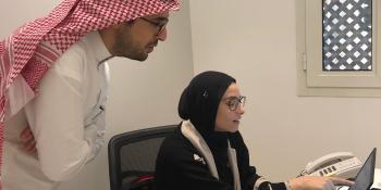 Saudi woman on a computer at work